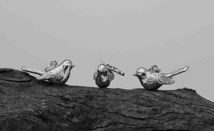 Silver robin charms.